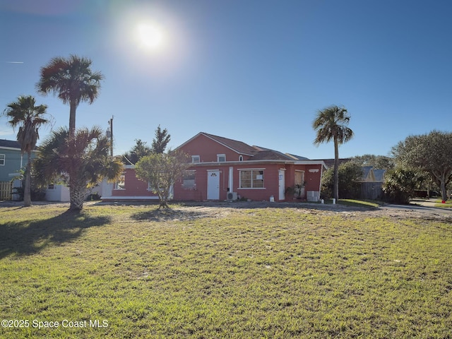 ranch-style home featuring a front yard