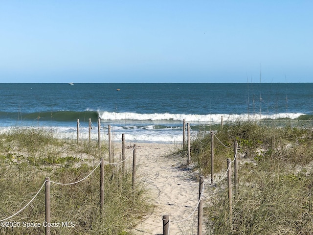 view of water feature with a beach view