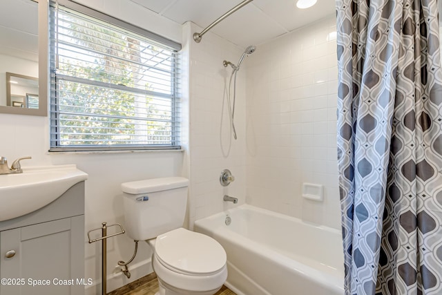 full bathroom with vanity, toilet, and shower / bath combo with shower curtain