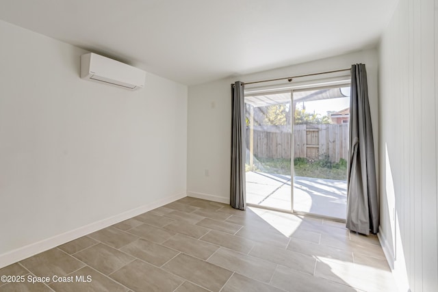 spare room with a wall mounted air conditioner