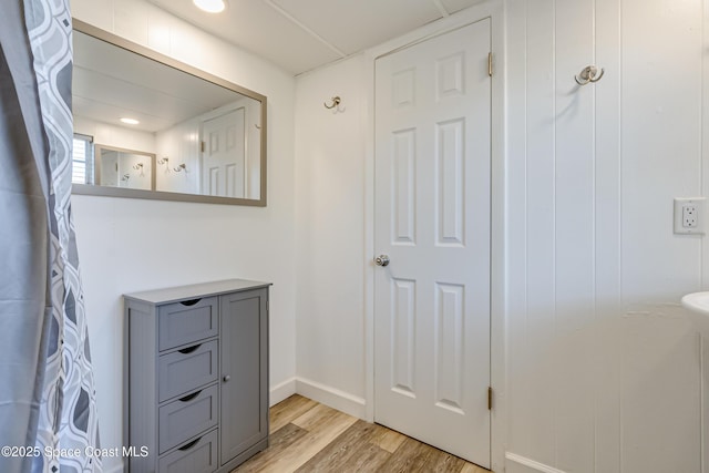 bathroom with wood-type flooring