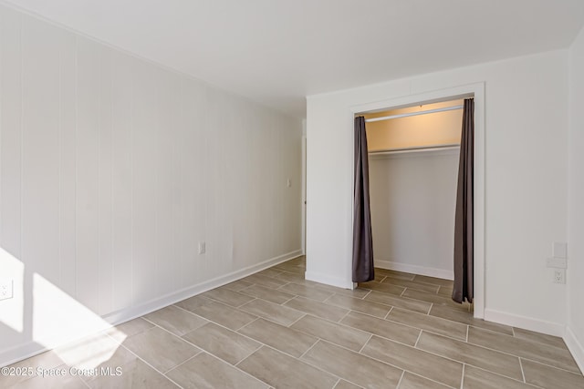 unfurnished bedroom with a closet