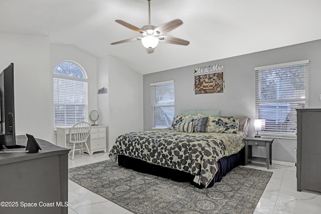 bedroom with lofted ceiling and ceiling fan