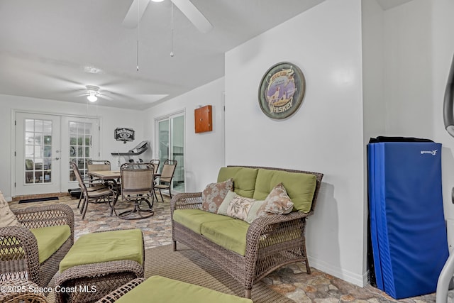 living room featuring french doors and ceiling fan