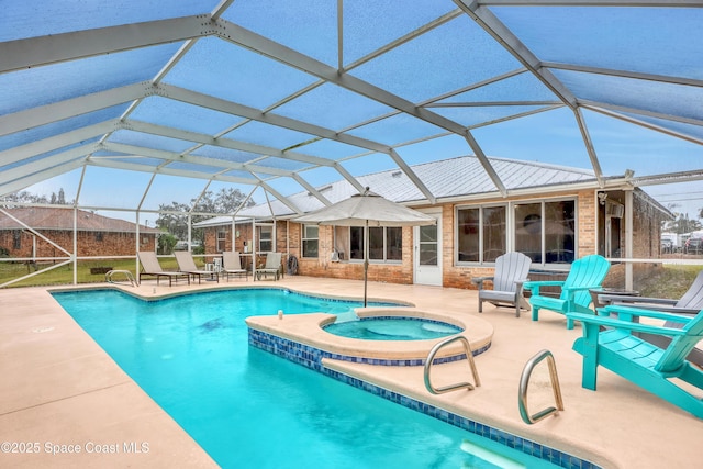 view of swimming pool with an in ground hot tub, a lanai, and a patio