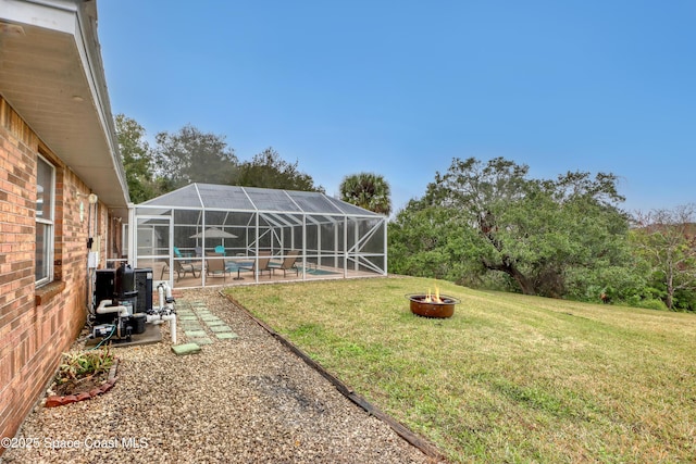 view of yard featuring a patio and a fire pit