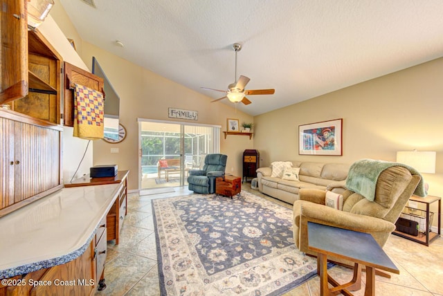 tiled living room with ceiling fan, a textured ceiling, and vaulted ceiling