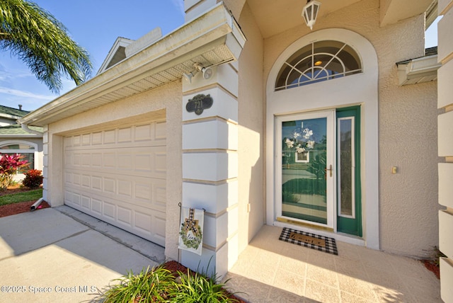 entrance to property featuring a garage