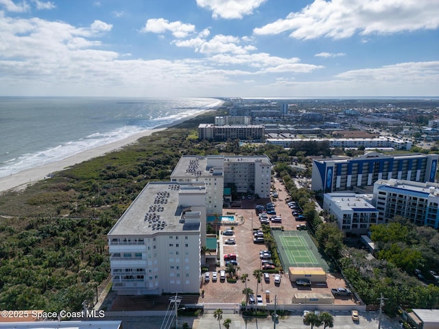 bird's eye view featuring a water view and a view of the beach