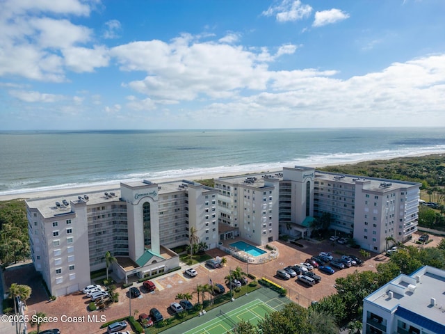 aerial view with a water view and a view of the beach