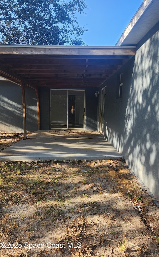 exterior space with a carport