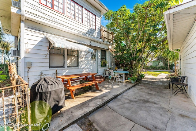 view of patio / terrace with grilling area and a balcony