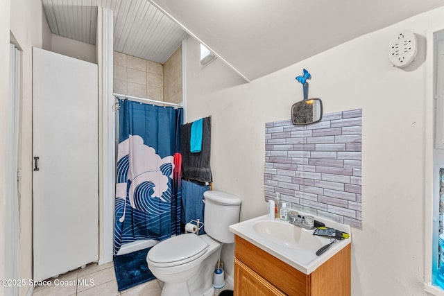 bathroom featuring tile patterned floors, walk in shower, vanity, and toilet