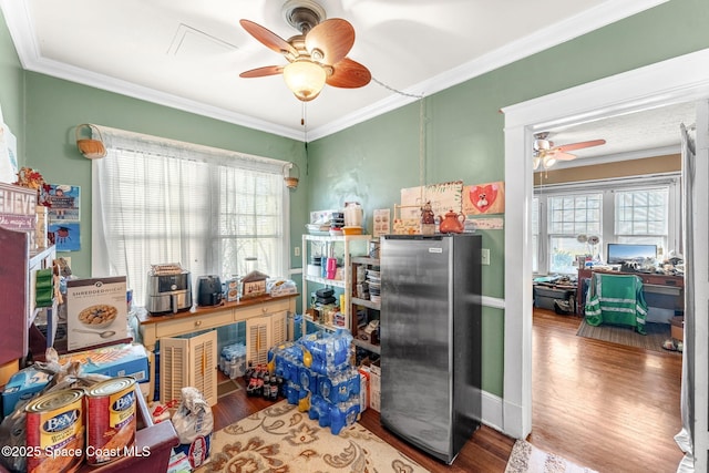 miscellaneous room with wood-type flooring and crown molding