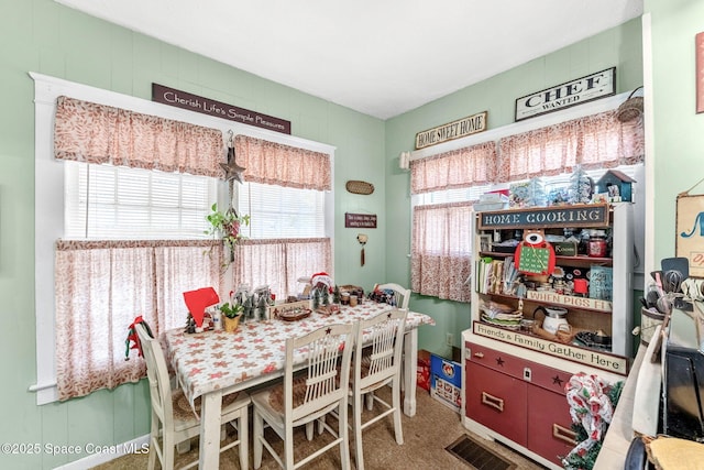 dining space featuring carpet floors