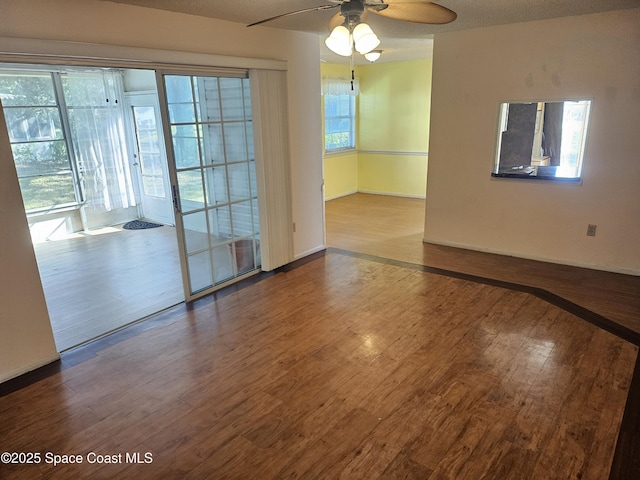 unfurnished room featuring hardwood / wood-style floors and ceiling fan