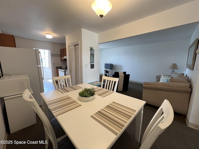 dining room featuring carpet