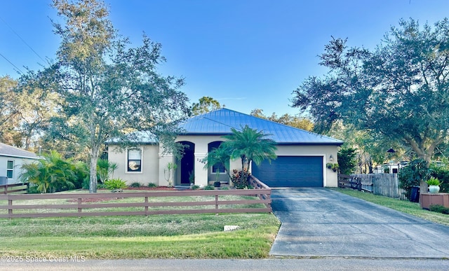 view of front facade with a garage and a front lawn