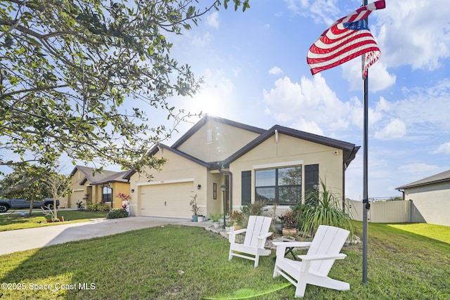 view of front of property with a garage and a front lawn