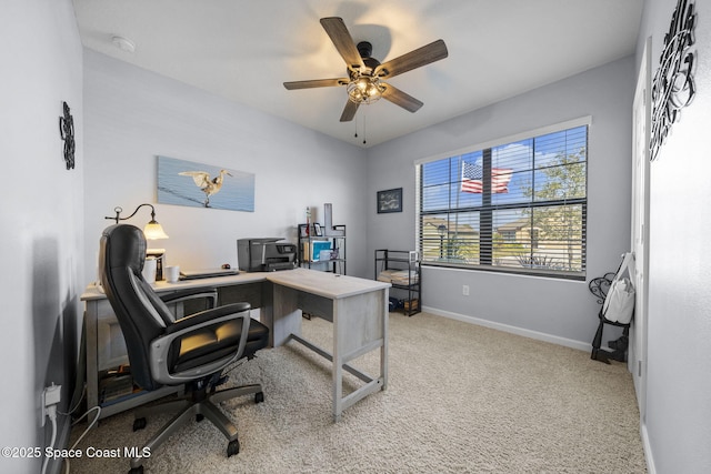 carpeted office with ceiling fan