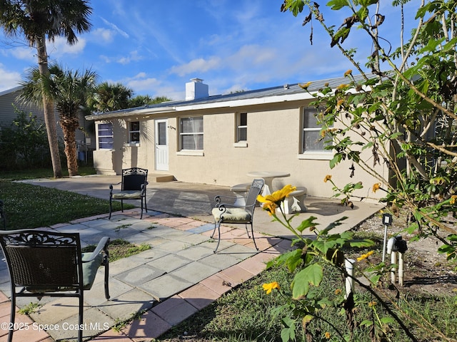 back of house featuring a patio area