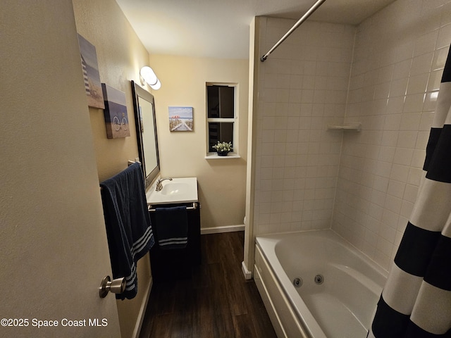 bathroom with shower / tub combo, vanity, and hardwood / wood-style floors