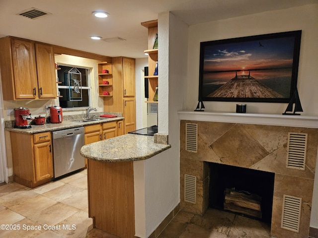 kitchen featuring light stone counters, stainless steel dishwasher, built in shelves, black electric cooktop, and sink