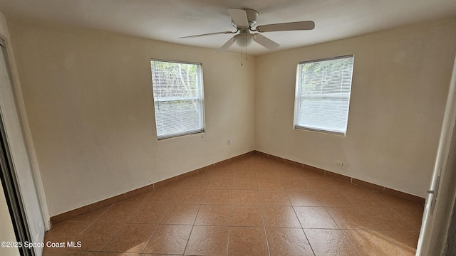 unfurnished room with ceiling fan