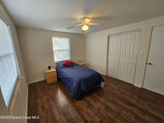 bedroom with ceiling fan and dark wood-type flooring