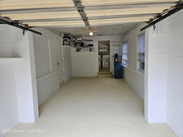 corridor featuring washer and dryer