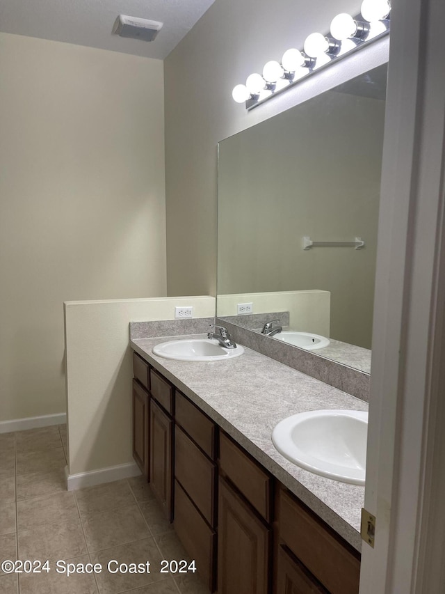 bathroom featuring tile patterned floors and vanity