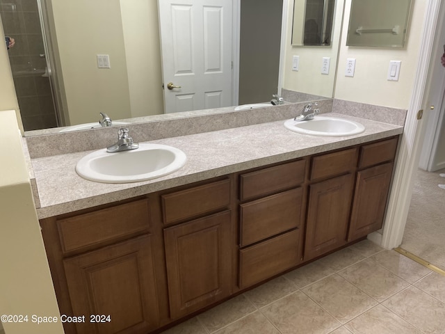 bathroom with tile patterned floors and vanity