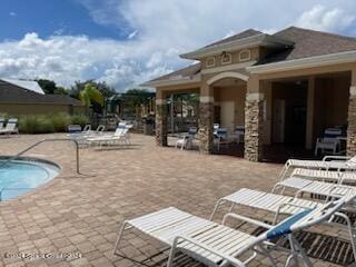 view of swimming pool featuring a patio area