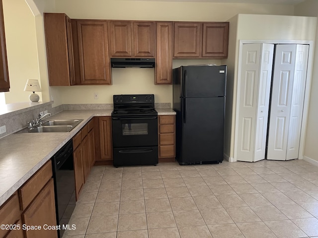 kitchen with sink, light tile patterned floors, and black appliances