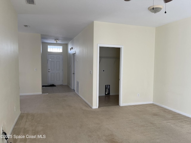 interior space featuring light carpet