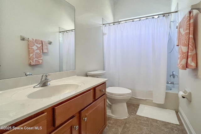 full bathroom featuring vanity, shower / bath combination with curtain, and toilet