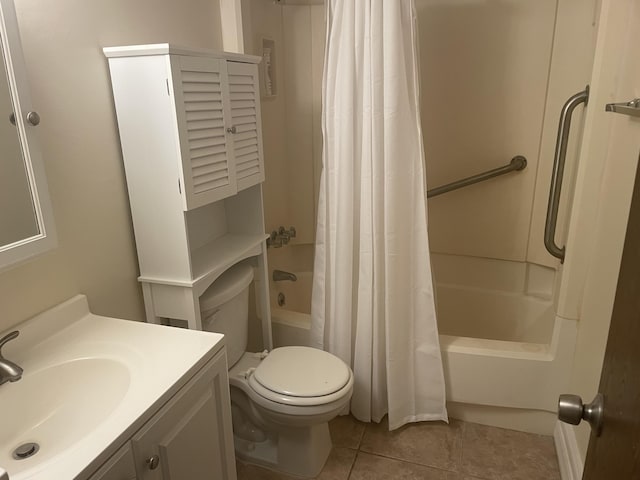 full bathroom featuring tile patterned floors, shower / bath combo with shower curtain, vanity, and toilet