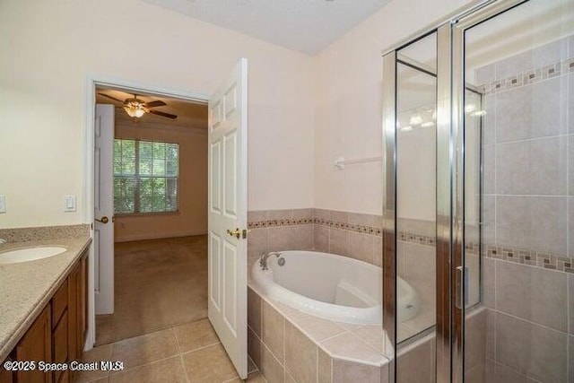 bathroom with vanity, tile patterned floors, ceiling fan, and separate shower and tub