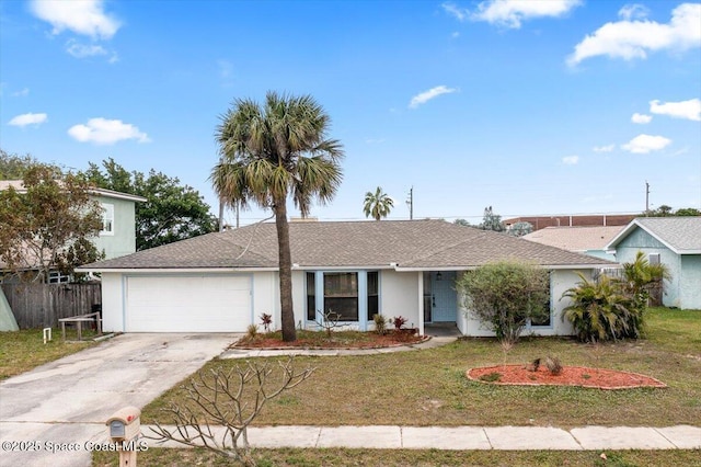 ranch-style home with a front lawn and a garage