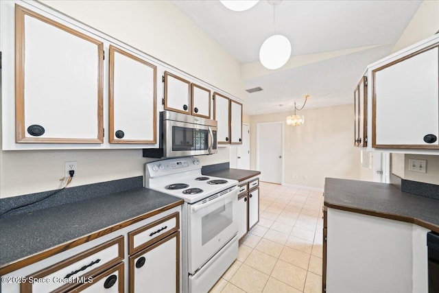 kitchen with an inviting chandelier, white cabinets, electric range, light tile patterned floors, and decorative light fixtures