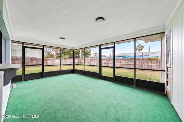 unfurnished sunroom featuring a wealth of natural light