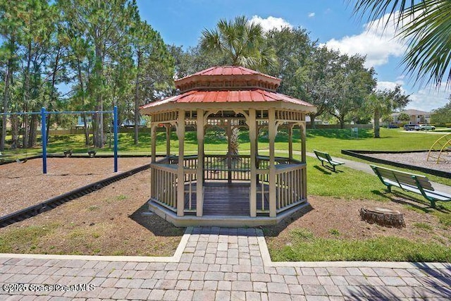 view of community featuring a yard, a gazebo, and a playground