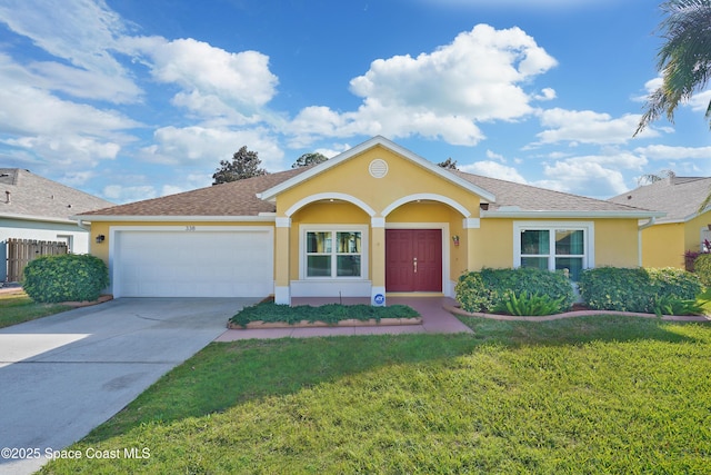 single story home with a garage and a front yard