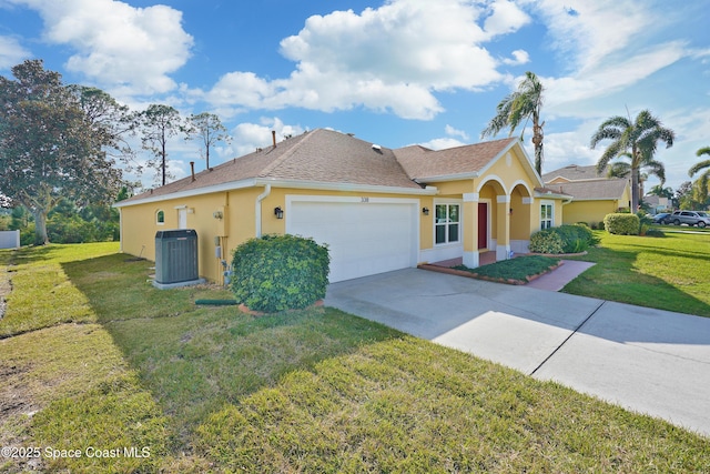 view of front of property featuring a garage, a front yard, and central AC unit