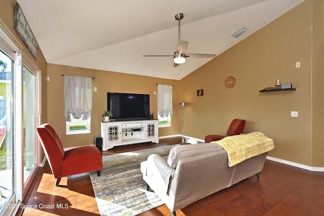 living room featuring hardwood / wood-style flooring, vaulted ceiling, and ceiling fan