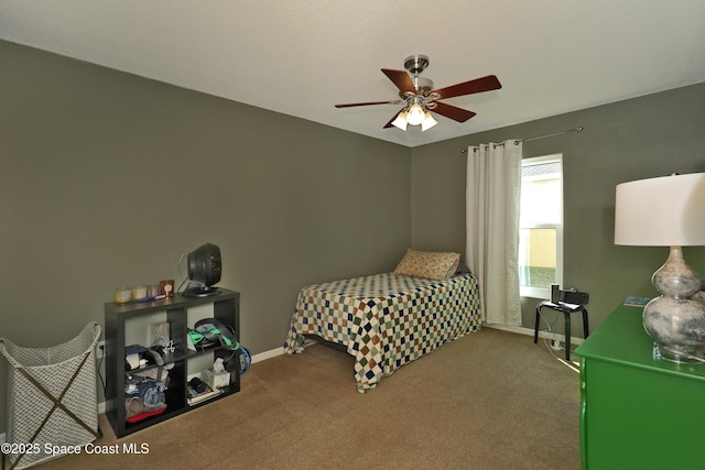 bedroom featuring ceiling fan and carpet floors