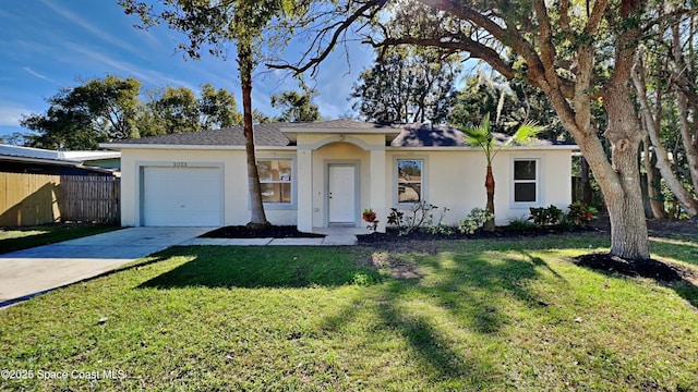 single story home featuring a garage and a front yard