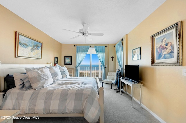 bedroom with carpet floors, access to exterior, and ceiling fan