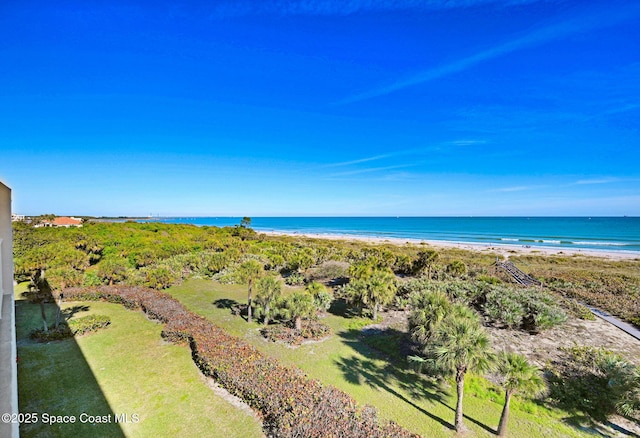 birds eye view of property with a view of the beach and a water view