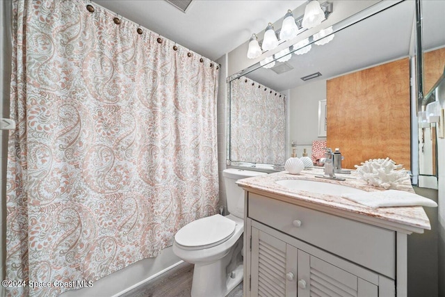 bathroom featuring hardwood / wood-style floors, vanity, and toilet